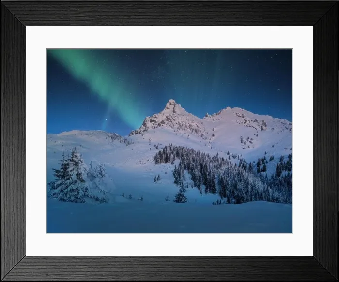Framed Print : Aurora Borealis appear over a snow covered mountain in winter landscape. Northern lights mountain landscape Framed Print : Aurora Borealis appear over a snow covered mountain in winter landscape. Northern lights mountain landscape