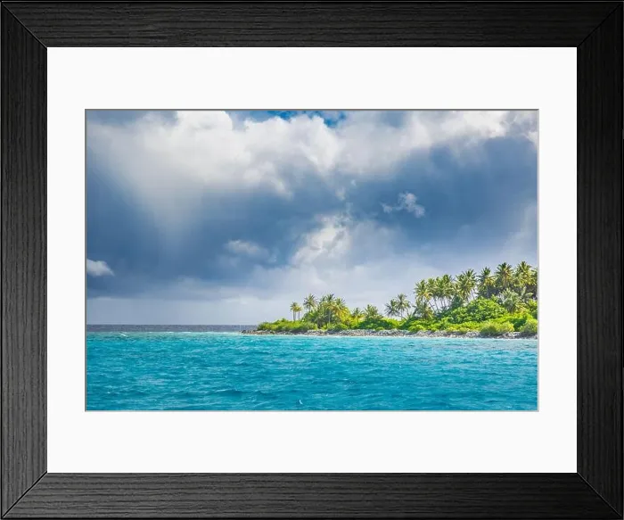 Framed Print : Overcast tropical beach with white sand, palm trees, turquoise ocean against cloudy sky with waves on sunny summer day. Perfect landscape background Framed Print : Overcast tropical beach with white sand, palm trees, turquoise ocean against cloudy sky with waves on sunny summer day. Perfect landscape background
