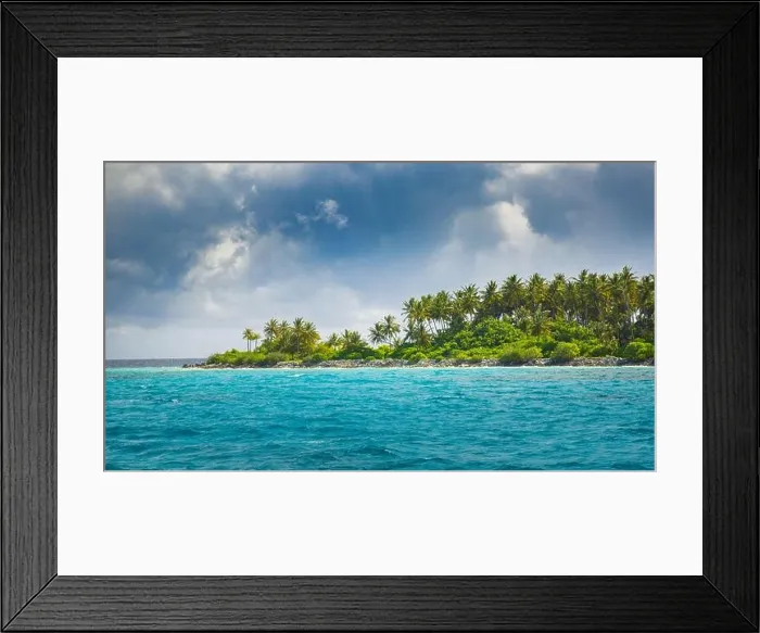 Framed Print : Overcast tropical beach with white sand, palm trees, turquoise ocean against cloudy sky with waves on sunny summer day. Perfect landscape background Framed Print : Overcast tropical beach with white sand, palm trees, turquoise ocean against cloudy sky with waves on sunny summer day. Perfect landscape background