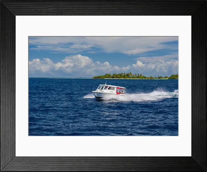 Framed Print : Ari Atoll, Maldives - December 17, 2015: Tourist speedboat fast cruising in the sea at Maldives, Indian Ocean. Speed boat docking to pick up tourists Framed Print : Ari Atoll, Maldives - December 17, 2015: Tourist speedboat fast cruising in the sea at Maldives, Indian Ocean. Speed boat docking to pick up tourists