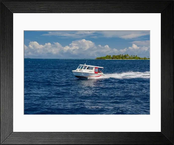 Framed Print : Ari Atoll, Maldives - December 17, 2015: Tourist speedboat fast cruising in the sea at Maldives, Indian Ocean. Speed boat docking to pick up tourists Framed Print : Ari Atoll, Maldives - December 17, 2015: Tourist speedboat fast cruising in the sea at Maldives, Indian Ocean. Speed boat docking to pick up tourists