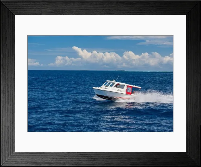 Framed Print : Ari Atoll, Maldives - December 17, 2015: Tourist speedboat fast cruising in the sea at Maldives, Indian Ocean. Speed boat docking to pick up tourists Framed Print : Ari Atoll, Maldives - December 17, 2015: Tourist speedboat fast cruising in the sea at Maldives, Indian Ocean. Speed boat docking to pick up tourists