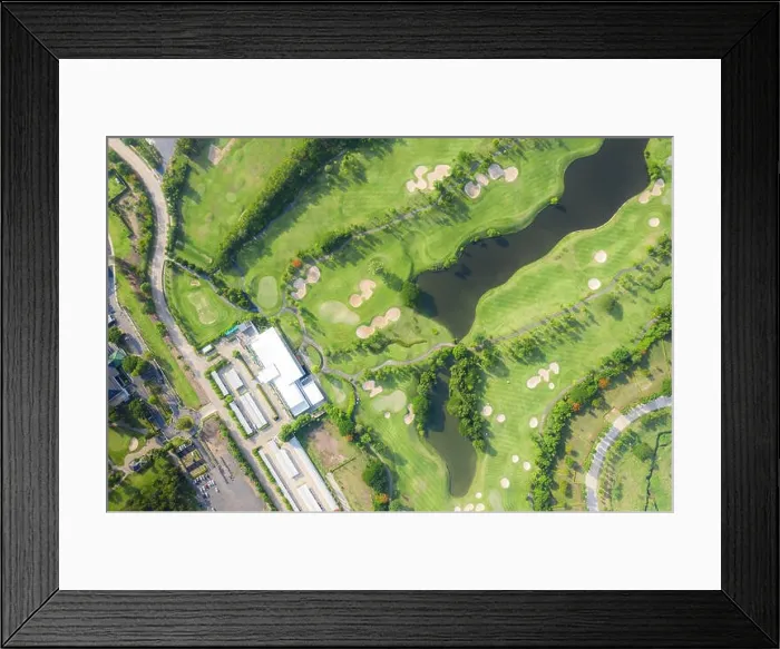 Framed Print : Aerial panoramic view of golf course and houses in city Framed Print : Aerial panoramic view of golf course and houses in city