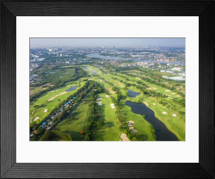 Framed Print : Aerial panoramic view of golf course and houses in city Framed Print : Aerial panoramic view of golf course and houses in city