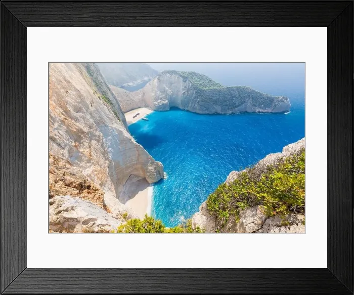 Framed Print : Navagio bay and Ship Wreck beach in summer. The most famous natural landmark of Zakynthos, Greek island in the Ionian Sea Framed Print : Navagio bay and Ship Wreck beach in summer. The most famous natural landmark of Zakynthos, Greek island in the Ionian Sea