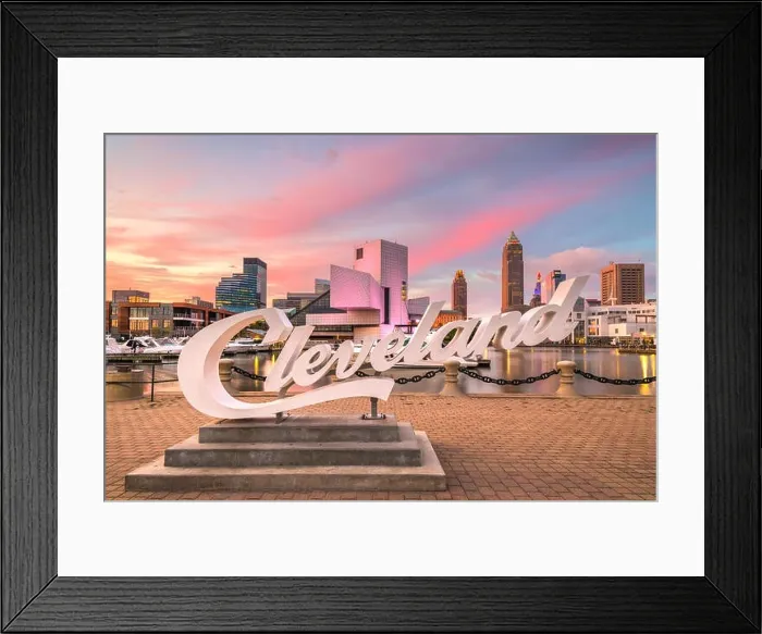 Framed Print : AUGUS1 10, 2019 - CLEVELAND, OHIO: The landmark skyline of downtown Cleveland from Voinovich Bicentennial Park in the early morning Framed Print : AUGUS1 10, 2019 - CLEVELAND, OHIO: The landmark skyline of downtown Cleveland from Voinovich Bicentennial Park in the early morning
