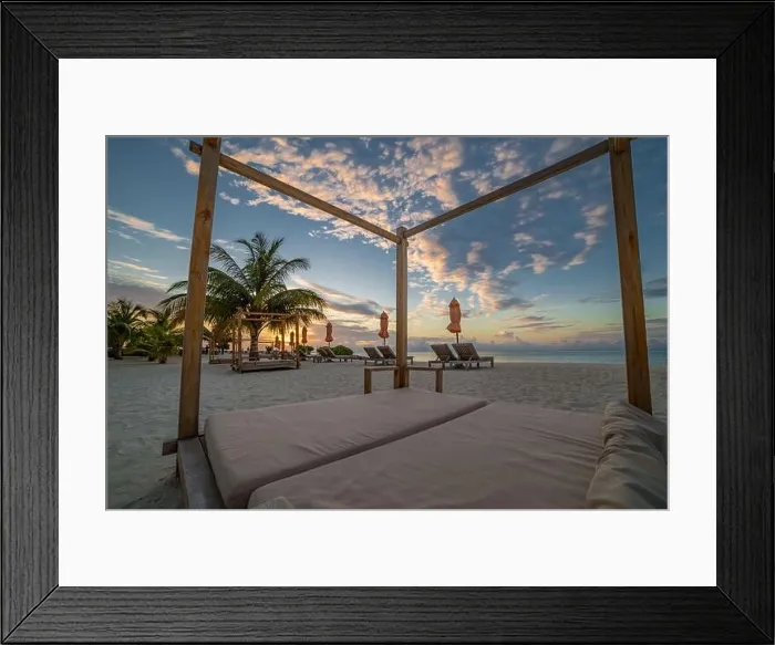 Framed Print : Summer beach landscape. Luxury vacation and holiday concept, summer travel banner. Panoramic landscape of sunset beach, two loungers umbrella, palms