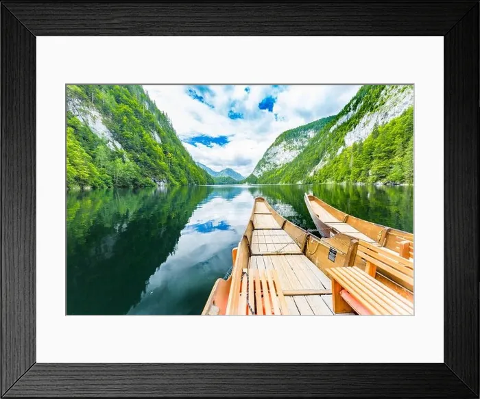 Framed Print : A dramatic sunset from an old canoe on a clam mountain lake in Framed Print : A dramatic sunset from an old canoe on a clam mountain lake in