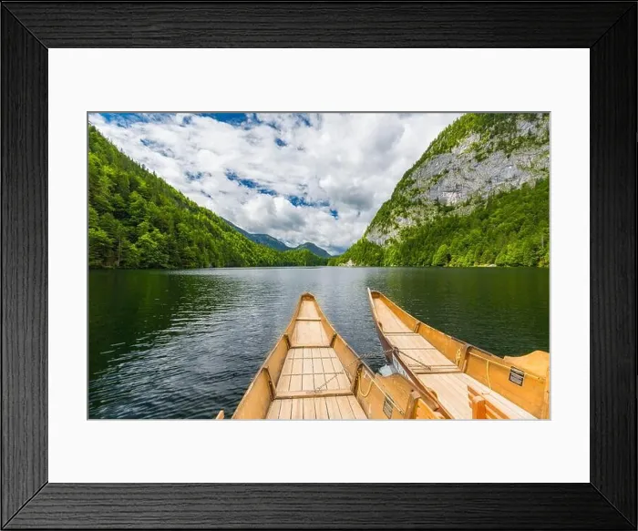 Framed Print : A dramatic sunset from an old canoe on a clam mountain lake in Framed Print : A dramatic sunset from an old canoe on a clam mountain lake in