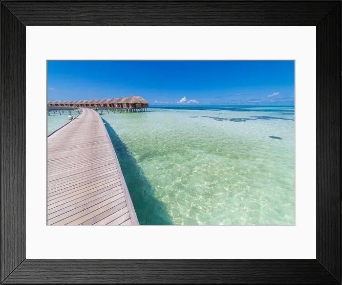 Framed Print : landscape of Maldives beach. Tropical panorama, luxury water villa resort with wooden pier jetty. Luxury travel destination background summer vacation Framed Print : landscape of Maldives beach. Tropical panorama, luxury water villa resort with wooden pier jetty. Luxury travel destination background summer vacation
