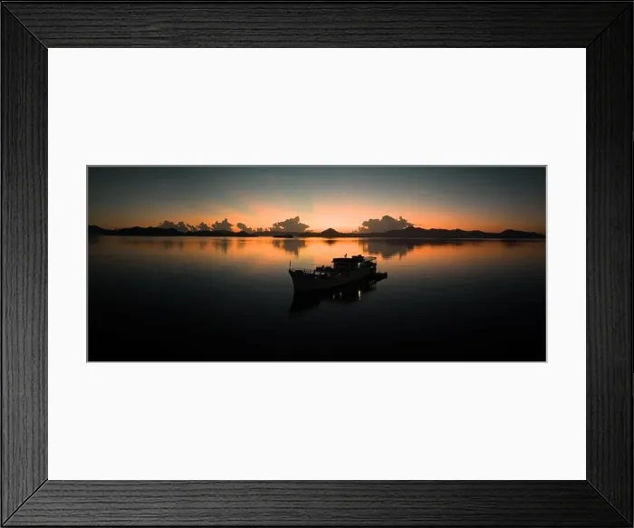 Framed Print : Sunrise illuminates the sky over the calm waters of the Solomon Islands. This scenic region is known for its spectacular marine biodiversity