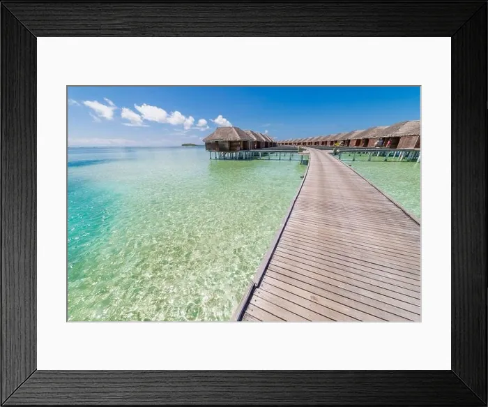 Framed Print : landscape of Maldives beach. Tropical panorama, luxury water villa resort with wooden pier jetty. Luxury travel destination background summer vacation Framed Print : landscape of Maldives beach. Tropical panorama, luxury water villa resort with wooden pier jetty. Luxury travel destination background summer vacation