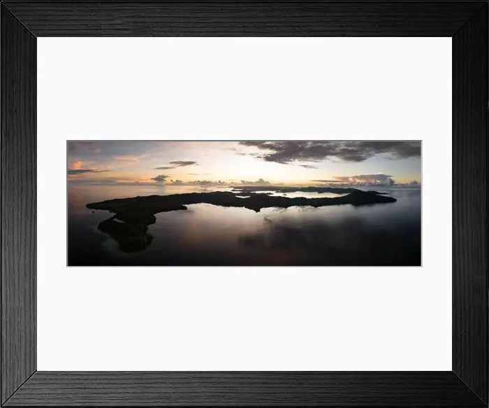 Framed Print : Sunrise illuminates clouds that drift over the calm waters of the Solomon Islands. This scenic region is known for its high marine biodiversity Framed Print : Sunrise illuminates clouds that drift over the calm waters of the Solomon Islands. This scenic region is known for its high marine biodiversity