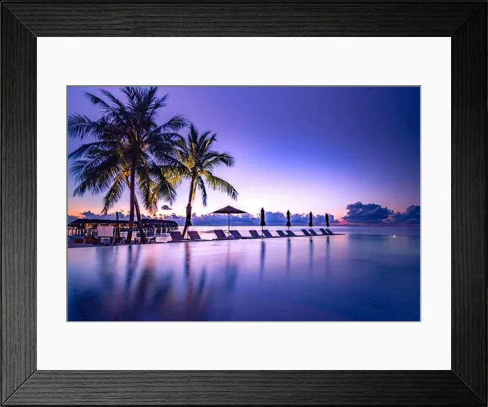 Framed Print : Beautiful poolside and sunset sky. Luxurious tropical beach landscape, deck chairs and loungers and water reflection. Infinity pool, sunset beach view Framed Print : Beautiful poolside and sunset sky. Luxurious tropical beach landscape, deck chairs and loungers and water reflection. Infinity pool, sunset beach view