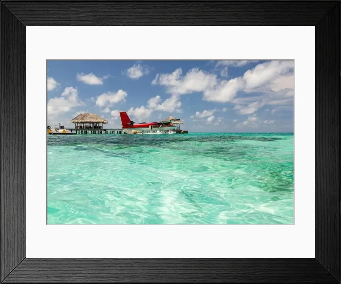 Framed Print : Seaplane at Maldives islands. Amazing blue lagoon, with red seaplane. Luxury travel and summer vacation concept Framed Print : Seaplane at Maldives islands. Amazing blue lagoon, with red seaplane. Luxury travel and summer vacation concept