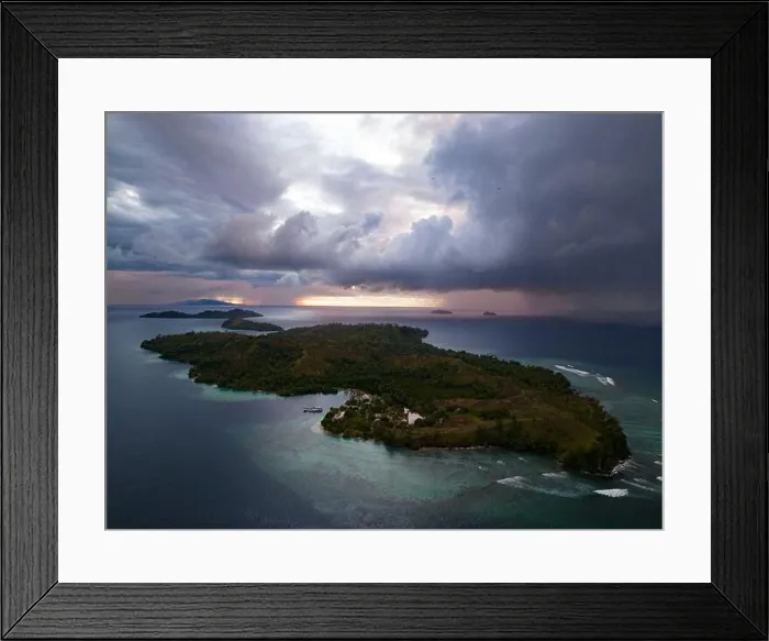 Framed Print : Storm clouds dump rain near a remote tropical island in the Solomon Islands. This beautiful country is home to spectacular marine biodiversity Framed Print : Storm clouds dump rain near a remote tropical island in the Solomon Islands. This beautiful country is home to spectacular marine biodiversity