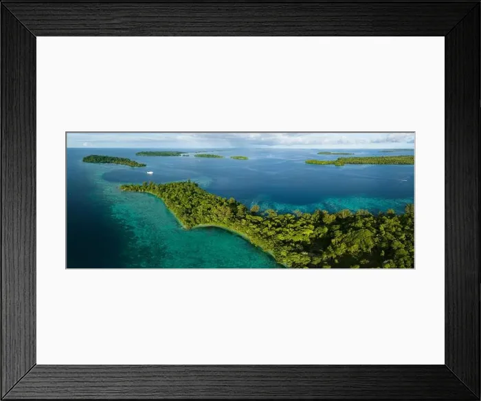 Framed Print : A scenic tropical island is fringed by a healthy coral reef in the Solomon Islands. This beautiful country is home to spectacular marine biodiversity Framed Print : A scenic tropical island is fringed by a healthy coral reef in the Solomon Islands. This beautiful country is home to spectacular marine biodiversity