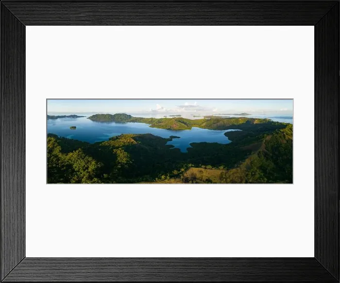 Framed Print : The first light of day illuminates clouds drifting above remote islands in the Solomon Islands. This scenic area is home to high marine biodiversity Framed Print : The first light of day illuminates clouds drifting above remote islands in the Solomon Islands. This scenic area is home to high marine biodiversity
