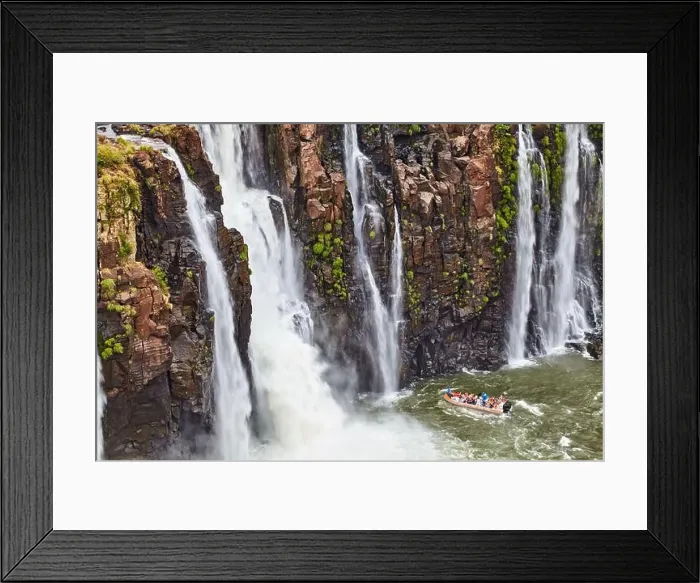 Framed Print : Popular tourist adventure activity at Iguazu Falls, speedboat approaches to water stream, view from Brazilian side Framed Print : Popular tourist adventure activity at Iguazu Falls, speedboat approaches to water stream, view from Brazilian side