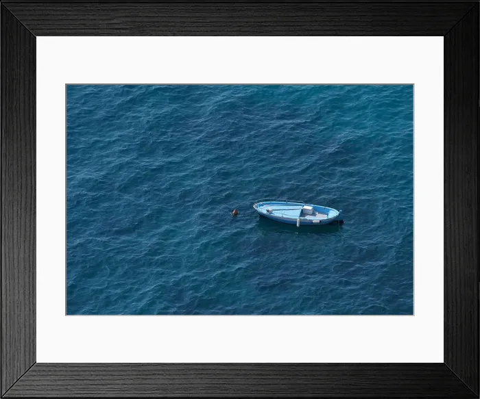 Framed Print : Aerial view of a blue boat on a blue clear sea water Framed Print : Aerial view of a blue boat on a blue clear sea water