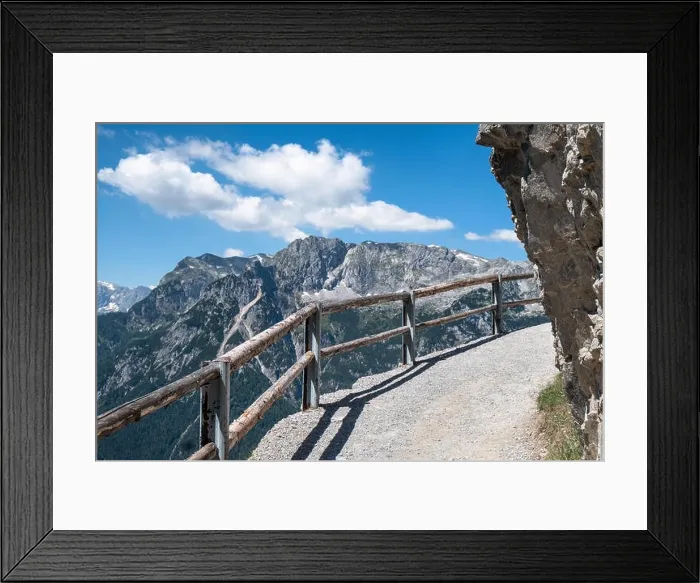 Framed Print : Mountain landscape with snow peaks and trail at bright sunny summer day in Alps, Austria Framed Print : Mountain landscape with snow peaks and trail at bright sunny summer day in Alps, Austria