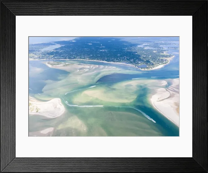 Framed Print : Small boats navigate a channel between sand islands on Cape Cod, Massachusetts. This beautiful area of New England is a popular vacation destination Framed Print : Small boats navigate a channel between sand islands on Cape Cod, Massachusetts. This beautiful area of New England is a popular vacation destination