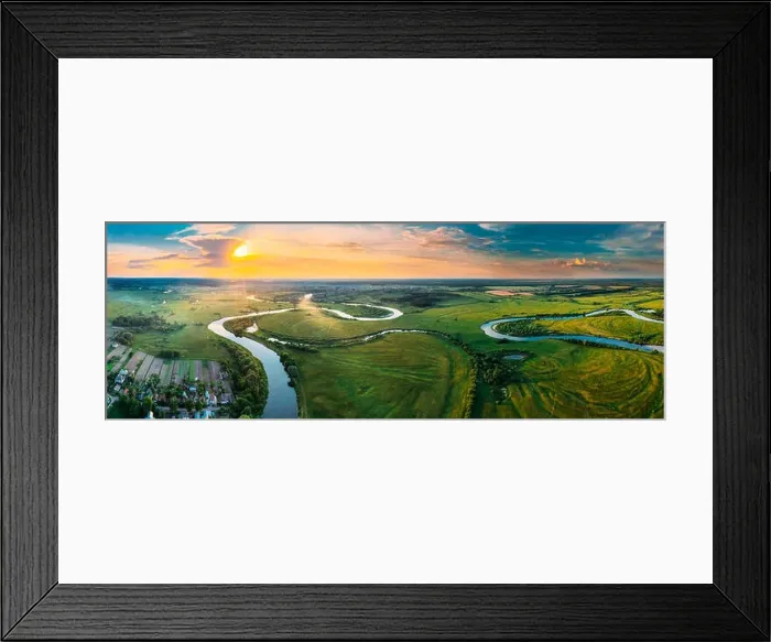 Framed Print : Aerial View Green Forest Woods Meadow And River Landscape In Sunny Spring Evening. Top View Of Beautiful European Nature From High Attitude In Summer Framed Print : Aerial View Green Forest Woods Meadow And River Landscape In Sunny Spring Evening. Top View Of Beautiful European Nature From High Attitude In Summer