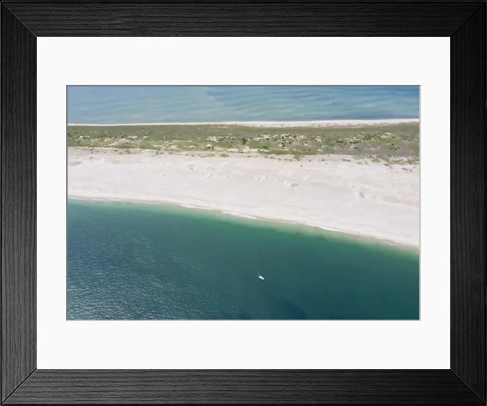 Framed Print : The cold waters of the Atlantic Ocean bathe a scenic beach on Cape Cod, Massachusetts. This beautiful part of New England is a popular vacation area Framed Print : The cold waters of the Atlantic Ocean bathe a scenic beach on Cape Cod, Massachusetts. This beautiful part of New England is a popular vacation area