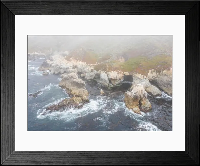 Framed Print : Seen from a bird's eye view, the cold waters of the Pacific Ocean wash against the rocky yet beautiful coast south of Monterey in Northern California Framed Print : Seen from a bird's eye view, the cold waters of the Pacific Ocean wash against the rocky yet beautiful coast south of Monterey in Northern California