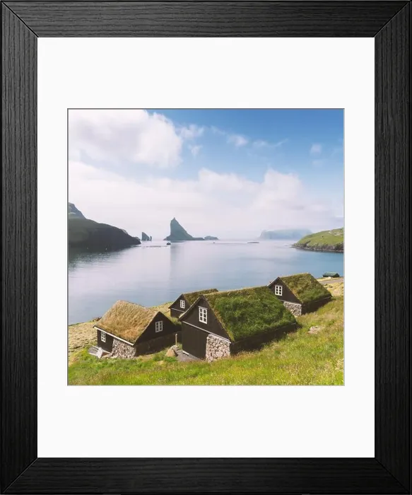 Framed Print : Picturesque view of tradicional faroese grass-covered houses in the village Bour. Drangarnir and Tindholmur sea stacks on background
