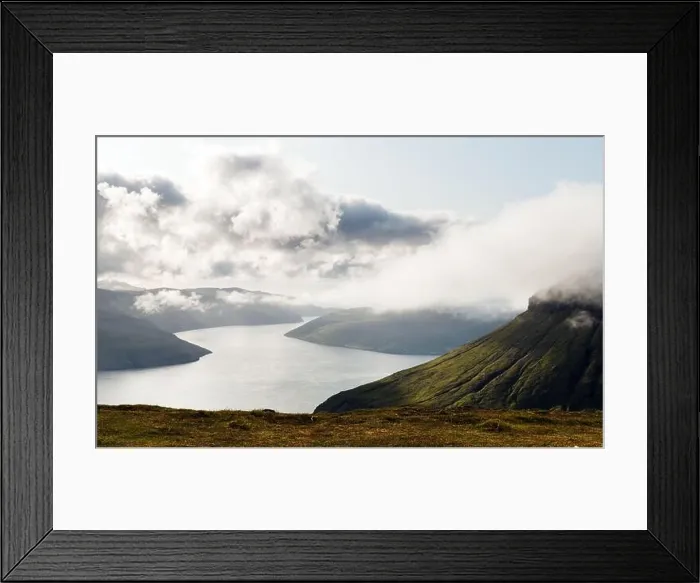 Framed Print : Foggy mountain peaks and clouds covering sea and mountains. Panoramical view from famous place - Sornfelli on Streymoy island, Faroe islands Framed Print : Foggy mountain peaks and clouds covering sea and mountains. Panoramical view from famous place - Sornfelli on Streymoy island, Faroe islands