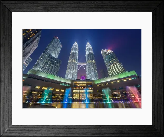 Framed Print : KUALA LUMPUR - SEPTEMBER 14, 2015: The Petronas Towers viewed from KLCC Park at twilight Framed Print : KUALA LUMPUR - SEPTEMBER 14, 2015: The Petronas Towers viewed from KLCC Park at twilight