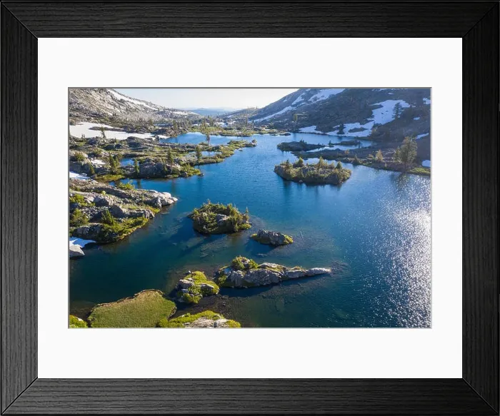 Framed Print : High granite mountains surround a beautiful lake in the Desolation Wilderness, California. This mountainous area is a popular backpacking destination Framed Print : High granite mountains surround a beautiful lake in the Desolation Wilderness, California. This mountainous area is a popular backpacking destination