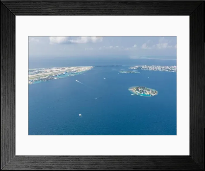 Framed Print : Maldives island capital island, Male. Hulhumale city island view from over the clouds. Aerial landscape in exotic travel destination Framed Print : Maldives island capital island, Male. Hulhumale city island view from over the clouds. Aerial landscape in exotic travel destination