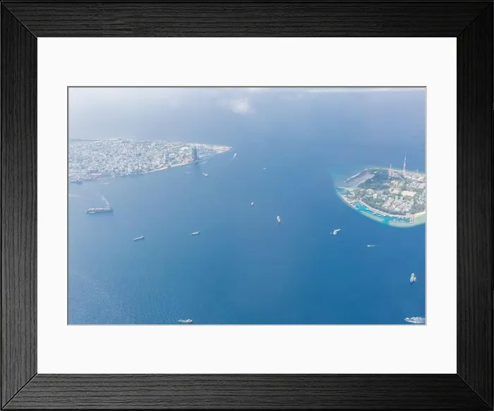 Framed Print : Maldives island capital island, Male. Hulhumale city island view from over the clouds. Aerial landscape in exotic travel destination Framed Print : Maldives island capital island, Male. Hulhumale city island view from over the clouds. Aerial landscape in exotic travel destination