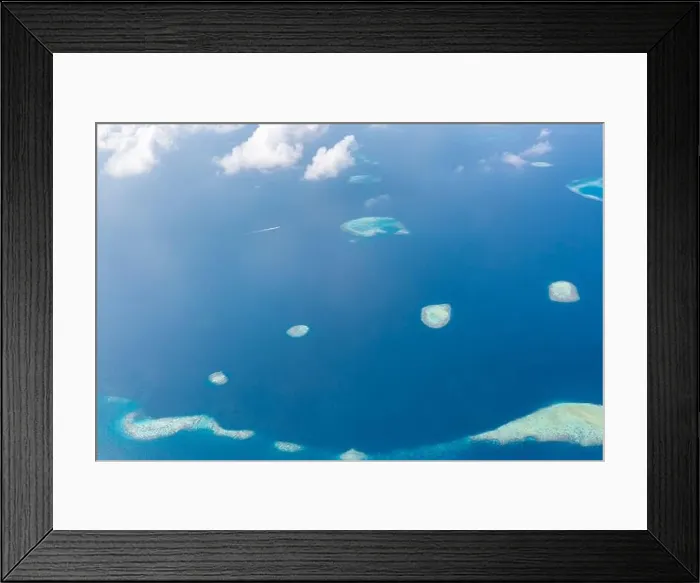 Framed Print : Aerial view of Maldives atolls is the world top beauty. Maldives tourism. Indian ocean with Maldivian island, aerial photography Framed Print : Aerial view of Maldives atolls is the world top beauty. Maldives tourism. Indian ocean with Maldivian island, aerial photography
