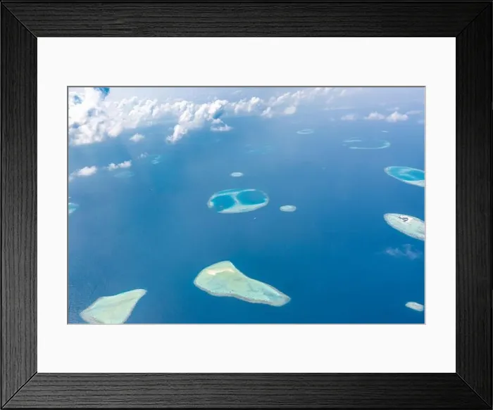 Framed Print : Aerial view of Maldives atolls is the world top beauty. Maldives tourism. Indian ocean with Maldivian island, aerial photography Framed Print : Aerial view of Maldives atolls is the world top beauty. Maldives tourism. Indian ocean with Maldivian island, aerial photography