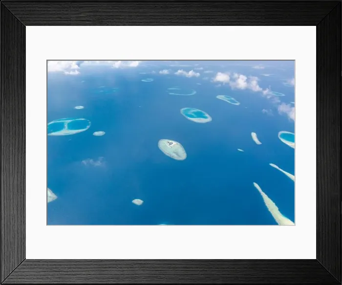 Framed Print : Aerial view of Maldives atolls is the world top beauty. Maldives tourism. Indian ocean with Maldivian island, aerial photography Framed Print : Aerial view of Maldives atolls is the world top beauty. Maldives tourism. Indian ocean with Maldivian island, aerial photography