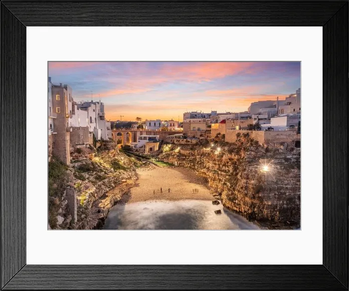 Framed Print : Polignano a Mare, Italy overlooking the beach at dusk Framed Print : Polignano a Mare, Italy overlooking the beach at dusk