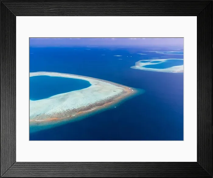 Framed Print : Aerial view of Maldives atolls is the world top beauty. Maldives tourism. Indian ocean with Maldivian island, aerial photography Framed Print : Aerial view of Maldives atolls is the world top beauty. Maldives tourism. Indian ocean with Maldivian island, aerial photography
