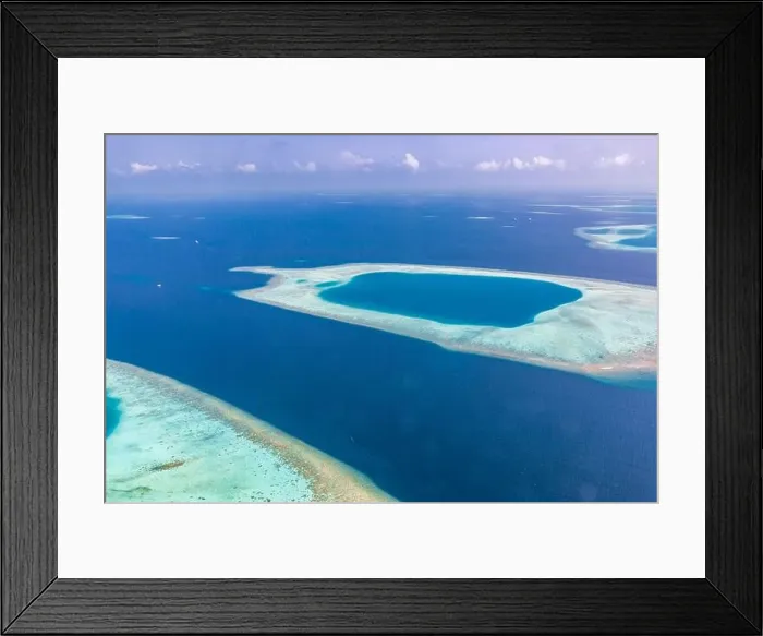 Framed Print : Aerial view of Maldives atolls is the world top beauty. Maldives tourism. Indian ocean with Maldivian island, aerial photography Framed Print : Aerial view of Maldives atolls is the world top beauty. Maldives tourism. Indian ocean with Maldivian island, aerial photography