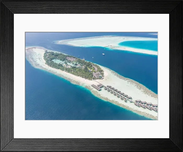 Framed Print : Aerial view of resort water bungalows. Luxury tropical hotel over coral reef connected with atolls in Indian ocean. Amazing travel landscape Framed Print : Aerial view of resort water bungalows. Luxury tropical hotel over coral reef connected with atolls in Indian ocean. Amazing travel landscape