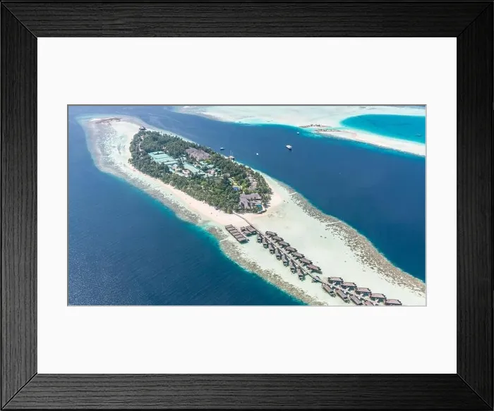 Framed Print : Aerial view of resort water bungalows. Luxury tropical hotel over coral reef connected with atolls in Indian ocean. Amazing travel landscape Framed Print : Aerial view of resort water bungalows. Luxury tropical hotel over coral reef connected with atolls in Indian ocean. Amazing travel landscape