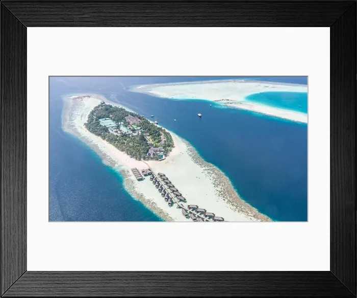 Framed Print : Aerial view of resort water bungalows. Luxury tropical hotel over coral reef connected with atolls in Indian ocean. Amazing travel landscape Framed Print : Aerial view of resort water bungalows. Luxury tropical hotel over coral reef connected with atolls in Indian ocean. Amazing travel landscape