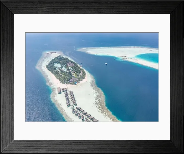 Framed Print : Aerial view of resort water bungalows. Luxury tropical hotel over coral reef connected with atolls in Indian ocean. Amazing travel landscape Framed Print : Aerial view of resort water bungalows. Luxury tropical hotel over coral reef connected with atolls in Indian ocean. Amazing travel landscape