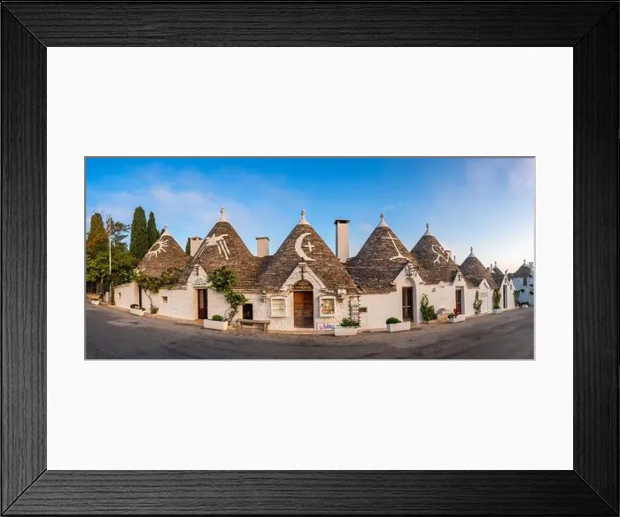 Framed Print : ALBEROBELLO, ITALY - OCTOBER 10, 2022: Trullo houses with the traditional symbols Framed Print : ALBEROBELLO, ITALY - OCTOBER 10, 2022: Trullo houses with the traditional symbols