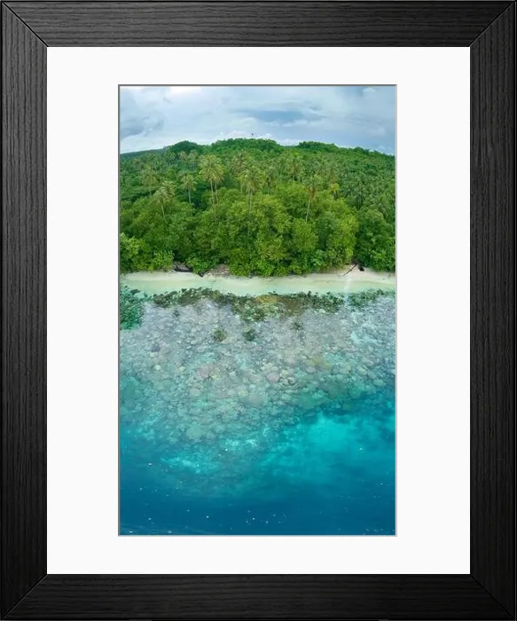 Framed Print : A lush, tropical island is fringed by a coral reef in the Solomon Islands. This beautiful country is home to spectacular marine biodiversity Framed Print : A lush, tropical island is fringed by a coral reef in the Solomon Islands. This beautiful country is home to spectacular marine biodiversity