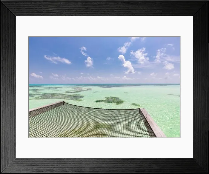 Framed Print : Luxury water hammock in paradise island sea resort. Summer beach travel and exotic vacation destination. Blue turquoise water, inspirational sea view Framed Print : Luxury water hammock in paradise island sea resort. Summer beach travel and exotic vacation destination. Blue turquoise water, inspirational sea view
