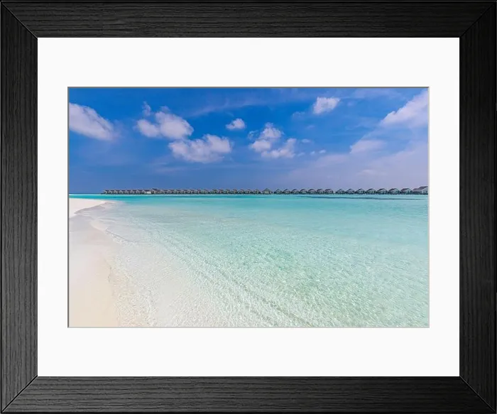 Framed Print : Amazing tropical Maldives resort hotel and island with beach sand and sea on sky for holiday vacation background concept. Soft sunrise light Framed Print : Amazing tropical Maldives resort hotel and island with beach sand and sea on sky for holiday vacation background concept. Soft sunrise light