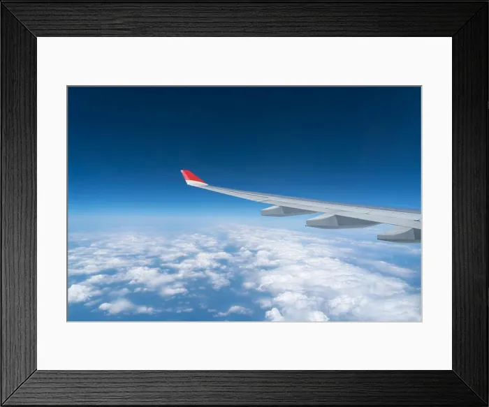 Framed Print : View from airplane window with blue sky and white clouds Framed Print : View from airplane window with blue sky and white clouds